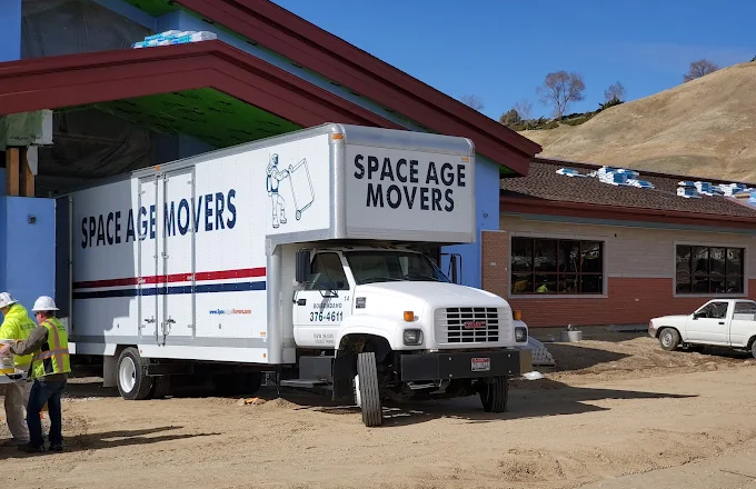space age movers big truck white taking off